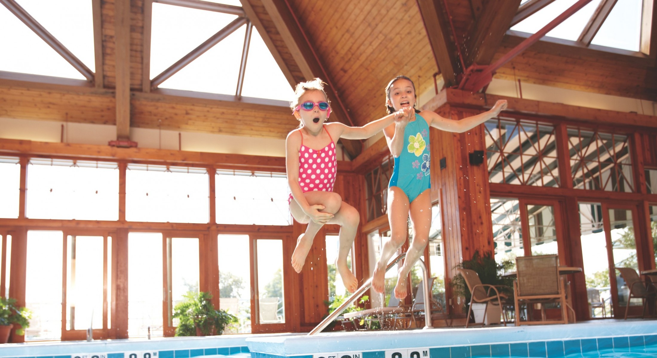 Kids jumping in the pool