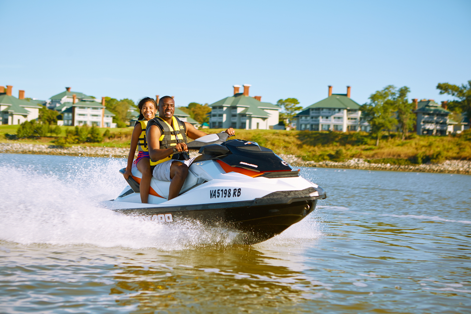 Father and Daughter Riding Jet Ski on James River