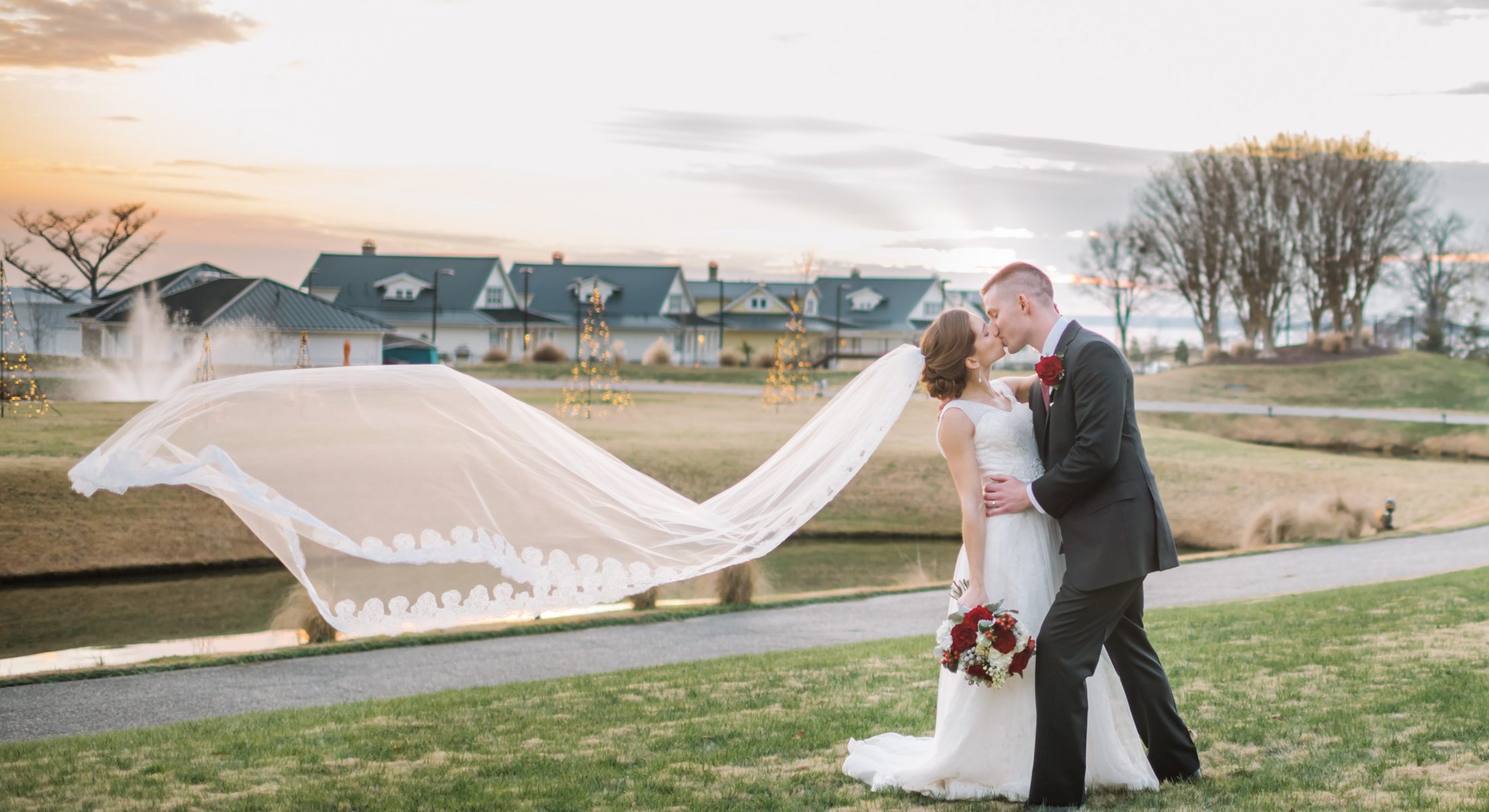 Wedding Couple Kissing on Lawn